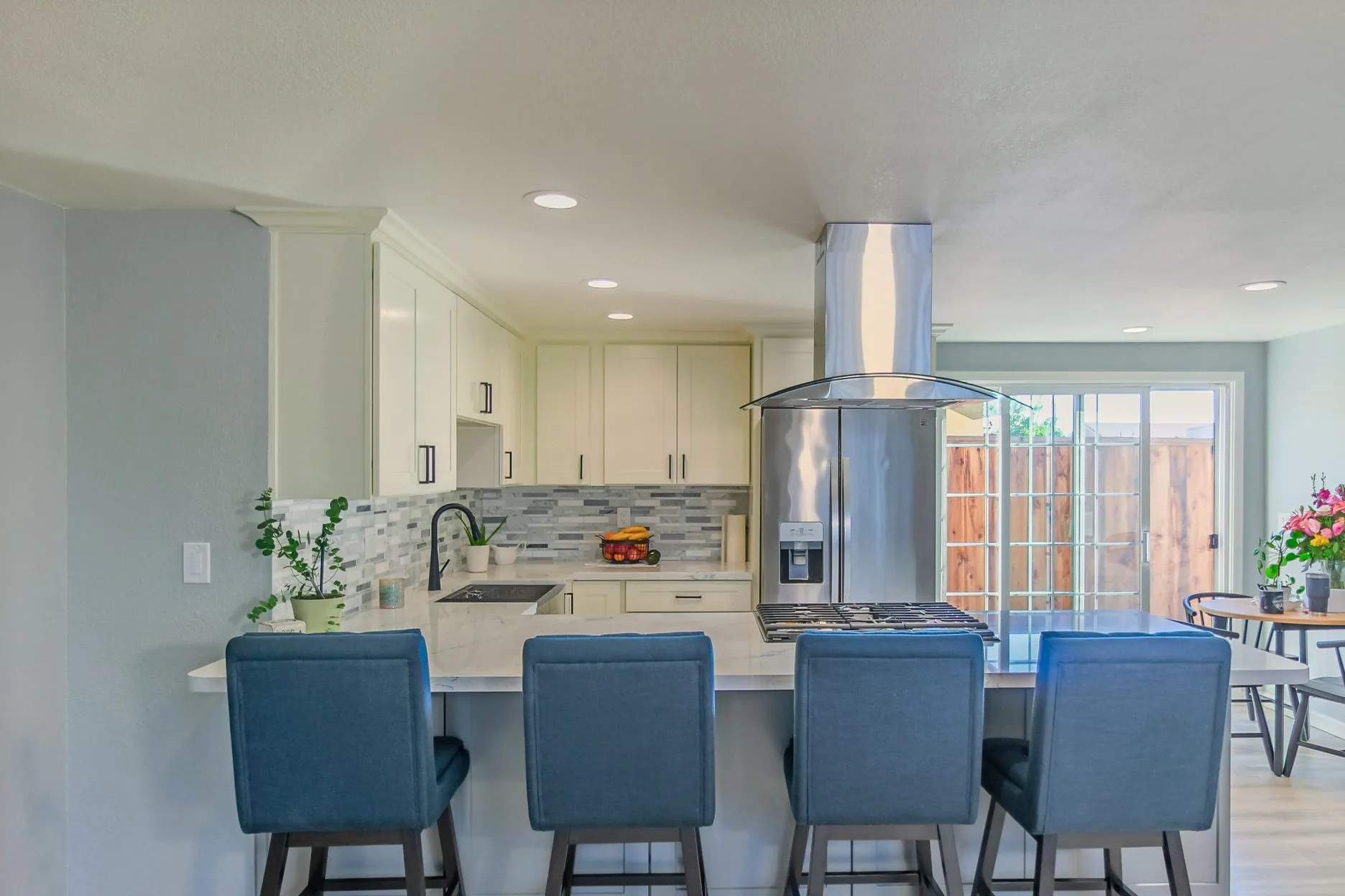 Kitchen with blue island stools